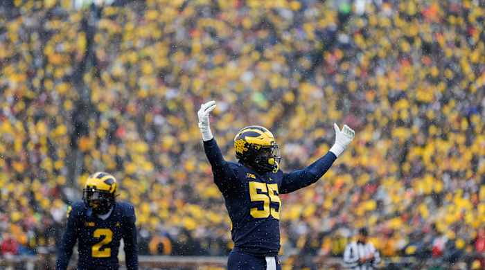 Michigan linebacker David Ojabo cheers the crowd
